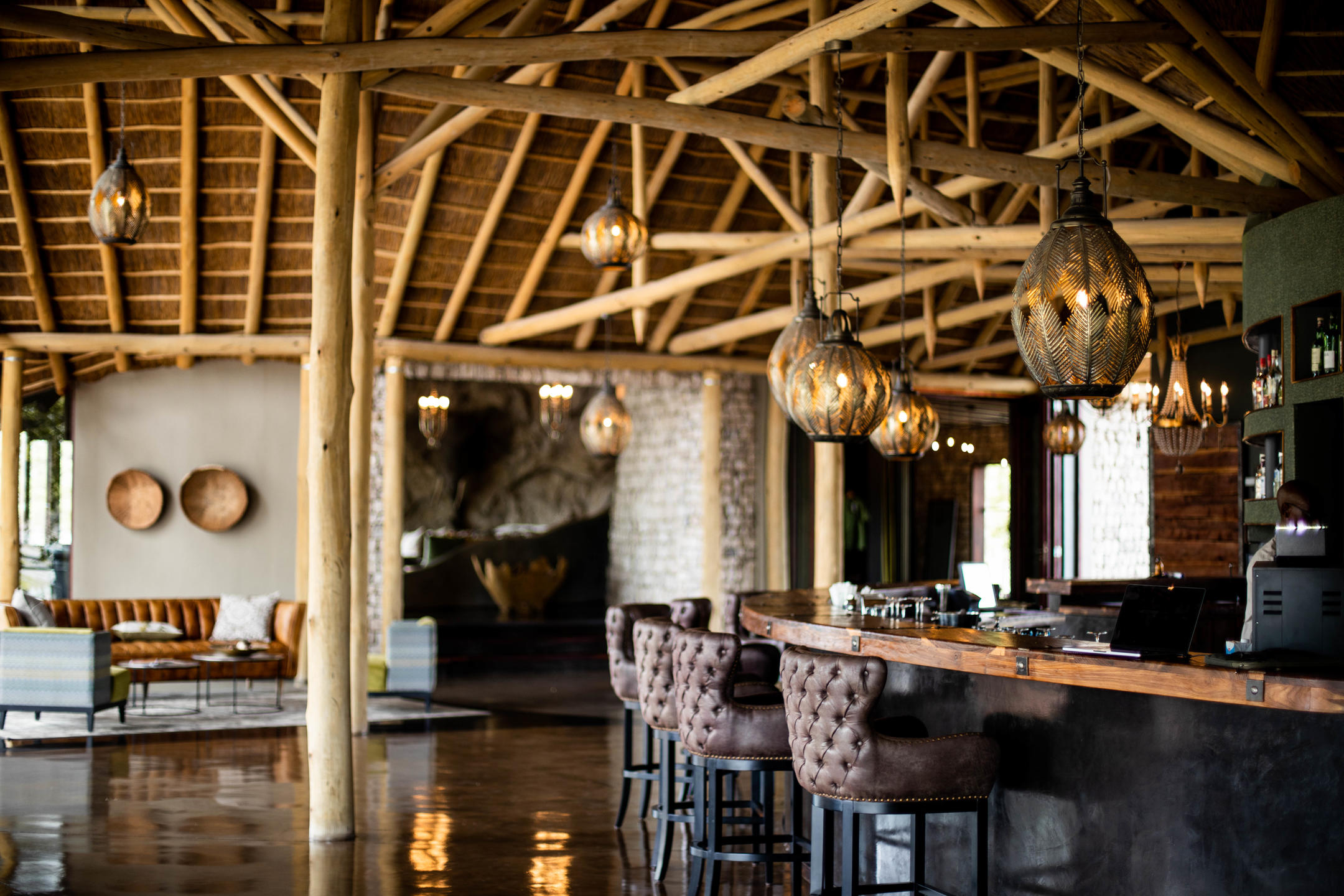 Main building surrounded by ancient mopane trees at Etosha Oberland Lodge