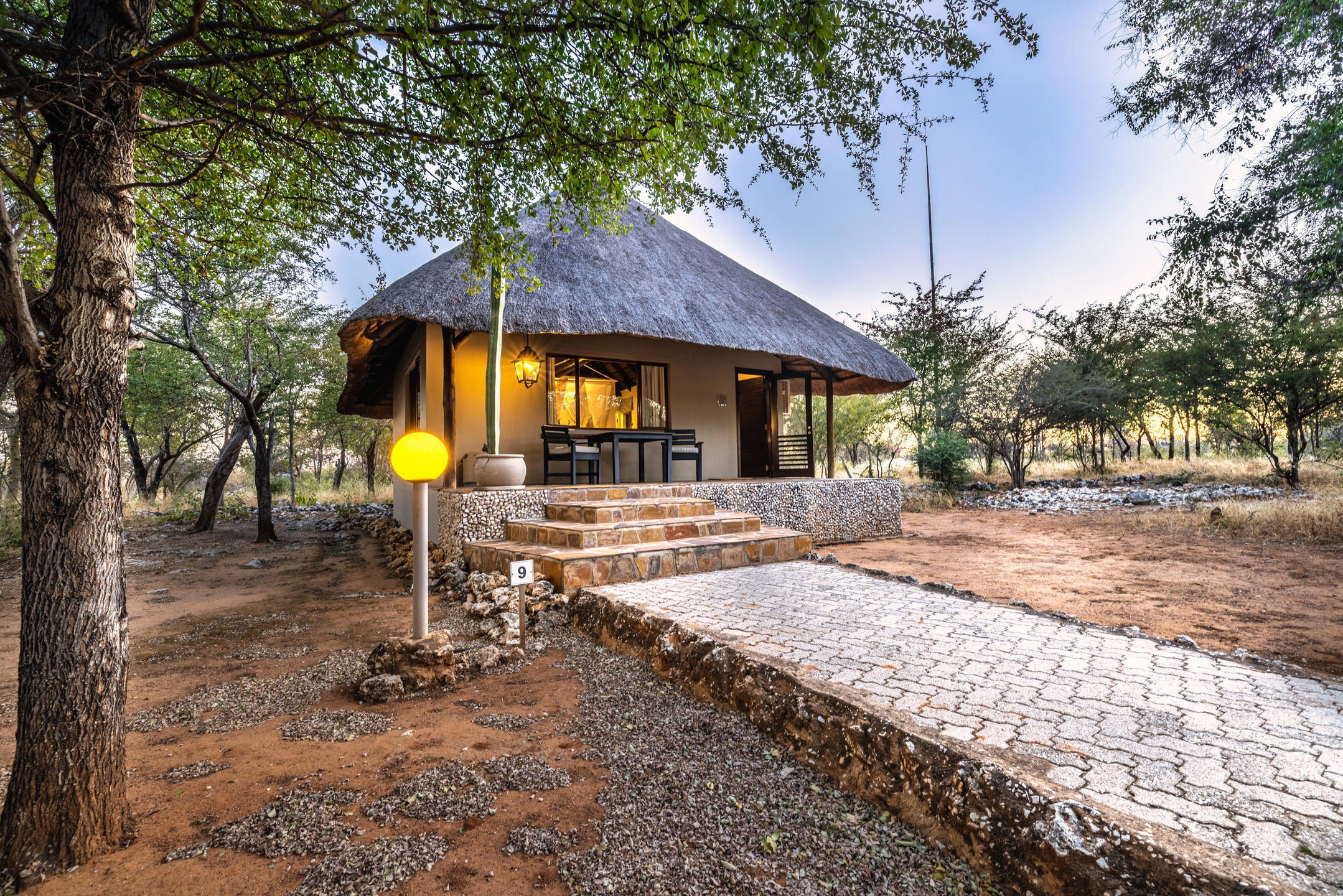 Traditional thatched luxury chalet at Mushara Lodge
