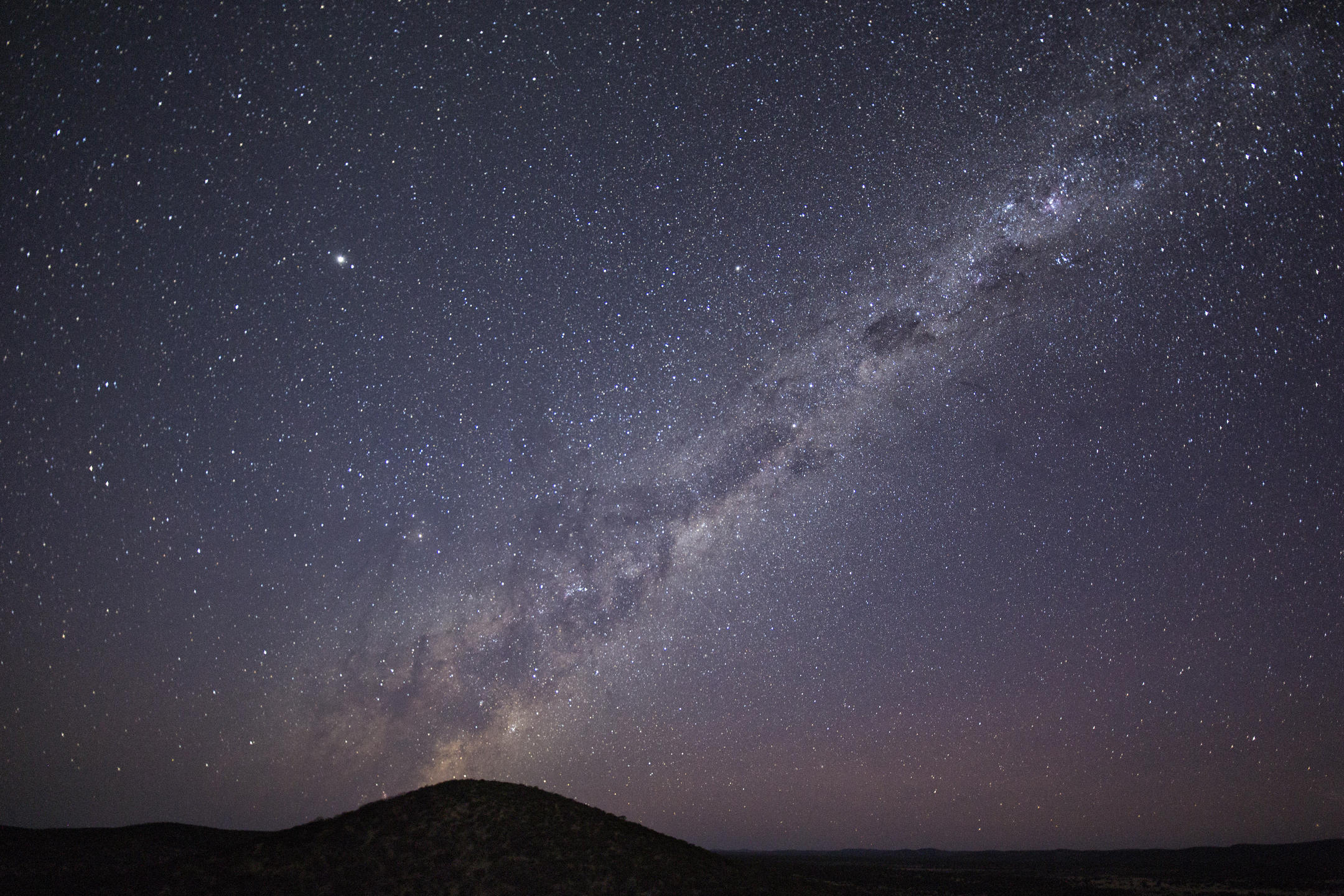 Stunning night view of the illuminated Safari House under the African sky